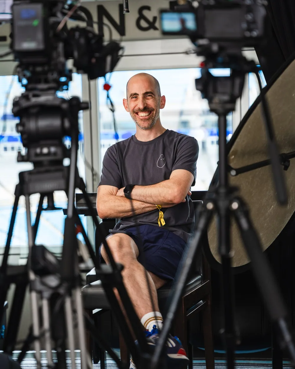 Jony Geron on set between camera rigs during a live studio build